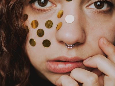 Close-up of a person's hands in a meditative pose.
